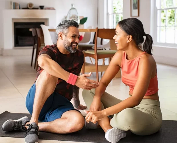 li-couple-laughing-doing-yoga